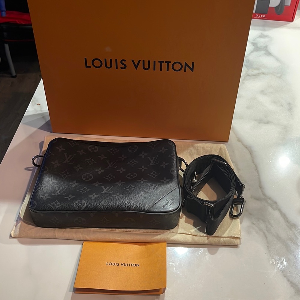 Louis Vuitton Trio Messenger w/ strap. Purchased 8/22 check receipt for $2219.